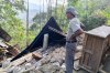 A man examines the damage to a building following an earthquake in East Manggarai, East Nusa Tenggara province, Indonesia, Saturday, Aug. 15, 2026. (AP Photo/Kurniawan)