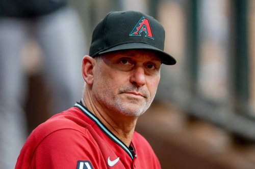 Arizona Diamondbacks manager Torey Lovullo in the dugout before the first pitch of a baseball game against the Atlanta Braves, Saturday, Aug. 15, 2026, in Atlanta. (AP Photo/Erik S. Lesser)
