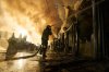 Firefighters try to put out a fire at a city book market following a Russian missile attack in Kyiv, Ukraine, early Sunday, Aug. 16, 2026. (AP Photo/Francisco Seco)