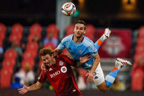 New York City FC's James Sands (6) jumps on top of Toronto FC's Josh Sargent (9) as they vie for the ball during first half MLS action in Toronto, on Saturday, Aug. 29, 2026. THE CANADIAN PRESS/Keito Newman