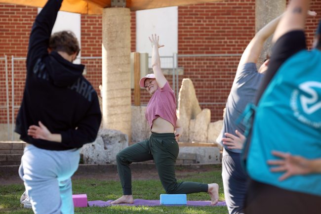 Emily Gill with Inspire Yoga Studio leads participants in a Yoga in the Park session at Princess Park in Brandon on Thursday. The weekly yoga sessions are one of many free events organized by the Brandon Downtown Biz during the summer in the Wheat City’s core. (Tim Smith/The Brandon Sun)