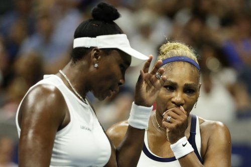 Venus Williams, left, and Serena Williams, of the United States, confer as they play against Hao-Ching Chan, of Taiwan, and Maya Joint, of Australia, during a women's doubles match at the U.S. Open tennis championships, Friday, Sept. 4, 2026, in New York. (AP Photo/Adam Hunger)