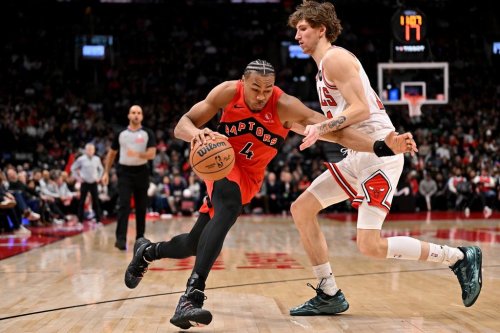 Toronto Raptors' Scottie Barnes (4) drives past Chicago Bulls' Matas Buzelis (14) during second half NBA basketball game action in Toronto on Thursday, Feb. 5, 2026. THE CANADIAN PRESS/Jon Blacker