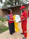 Meaghan Thumath, left, a registered nurse and public health delegate with the Canadian Red Cross, examines personal protection equipment with a Red Cross member in an undated handout photo in the Democratic Republic of Congo. Handout. THE CANADIAN PRESS/Handout - Doctors Withour Borders (Mandatory Credit)