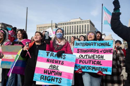 Protesters gather at the Alberta legislature during a rally for trans rights in Edmonton in February 2024. Leah Hamilton and Corrine L. Mason write that when political leaders like Alberta Premier Danielle Smith &ldquo;weaponize trans-exclusionary framing, support for trans rights drops significantly.&rdquo; (The Canadian Press files)