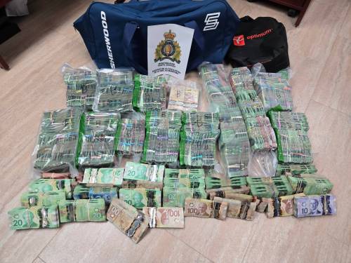 The Manitoba RCMP seized approximately $970,000 during a traffic stop on July 31 near Brandon. Police have charged Ahmad Ahmadi, 44 from Stouffville, Ont. and Alireza Haghgoo, 22, from Toronto, Ont. with possession of property obtained by crime for the purpose of drug trafficking. (Photo submitted by RCMP)