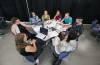 Participants chat at one of several tables set up at Brandon University for a public listening session organized by the province to gather perspectives on the governance and responsible use of artificial intelligence, cybersecurity and the protection of Manitobans' data. (Matt Goerzen/The Brandon Sun)