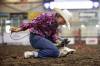 Billie Cowan of Gainsborough, Sask., ties a goat&rsquo;s legs while competing in the goat-tying event during the high school rodeo on the opening day of the 2026 Virden Indoor Rodeo and Wild West Daze on Thursday.
