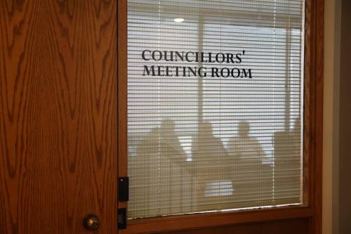 Council members and city staff speak during a closed meeting more than an hour ahead of a regular council meeting on July 6. (Alex Lambert/The Brandon Sun)