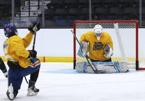 Goalie Connor Dwyer of Bismarck, N.D., makes a save on forward Memphis Adeniken during a practice on Thursday during Brandon Wheat Kings training camp at Assiniboine Credit Union Place. The American netminder is one of four goalies competing for a spot behind starter Filip Ruzicka. (Perry Bergson/The Brandon Sun)
                                Aug. 27, 2026