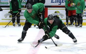 Teammates Cameron Allard, left, and Chase Surkan battle for the puck during a competition drill at Brandon Wheat Kings camp last Thursday. The two were impressed by how well everyone played during the camp. (Perry Bergson/The Brandon Sun)