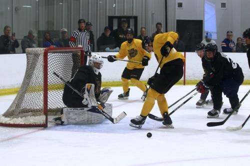 Team Black goalie Ryley Budd (33) watches as the puck squirts between the legs of Team Gold forward Brady Turko during the annual Black and Gold game at J&G Homes Arena on Sunday evening that signals the end of training camp. (Perry Bergson/The Brandon Sun)