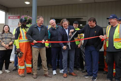 Corey Wagner, solid waste manager for the City of Brandon, Coun. Tyson Tame (Ward 10), Mayor Jeff Fawcett and Brandon East MLA Glen Simard cut a ribbon with other dignitaries during the opening ceremony for the new Eastview Residential Diversion Depot at the Eastview Landfill on Friday. (Tim Smith/The Brandon Sun)