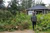 Michelle Martens stands outside her home in Elkhorn surrounded by broken trees after a tornado ripped through her backyard Sunday evening. (Rylee Gerrard/The Brandon Sun)