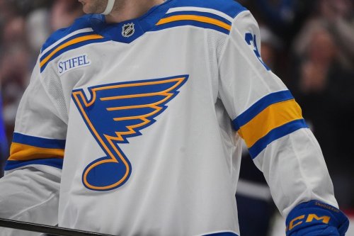 The St. Louis Blues logo is shown on a player's sweater during an NHL hockey game in Denver on Dec. 31, 2025. (AP Photo/David Zalubowski)
