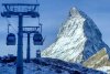 Gondolas go up next to the Matterhorn in Zermatt, Switzerland, Thursday, Dec.3, 2020. (AP Photo/Jamey Keaten)