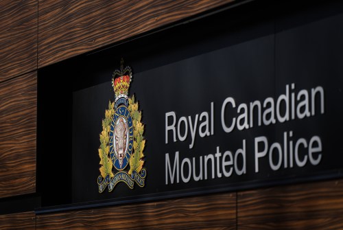 The RCMP logo is seen outside the force's 'E' division headquarters in Surrey, B.C., on Thursday, March 16, 2023. RCMP say a toddler has died after he was run over by a pickup truck on the driveway of his home in northwestern Manitoba. THE CANADIAN PRESS/Darryl Dyck