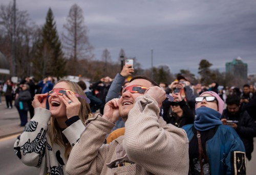 People watch the total solar eclipse in Niagara Falls, Ont., on Monday, April 8, 2024. THE CANADIAN PRESS/Aaron Lynett