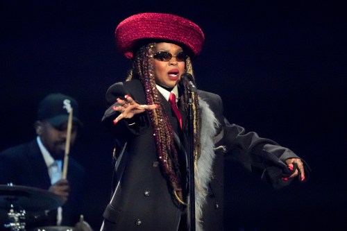 FILE - Singer Lauryn Hill performs during the draw for the 2026 soccer World Cup at the Kennedy Center in Washington, Dec. 5, 2025. (AP Photo/Chris Carlson, File)