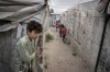 Children play through al-Karama camp, established in the early years of the Syrian conflict, near the village of Atmeh, Idlib province, Syria, on May 19, 2026. (AP Photo/Omar Albam, File)