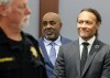 Duane Davis, center, stands with his attorney Michael Sanft, right, as prospective jurors enter the courtroom during the fourth day of jury selection for his murder trial in Clark County District Court at the Regional Justice Center on Thursday, Aug. 13, 2026, in Las Vegas. Davis was indicted on murder charges for his involvement in the killing of rapper Tupac Shakur in 1996. (Bizuayehu Tesfaye/Las Vegas Review-Journal via AP, Pool)