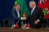 Premier of Saskatchewan Scott Moe, left, and Premier of Ontario Doug Ford shake hands during a media event to sign a Memorandum of Understanding in Saskatoon on Sunday, June 1, 2025. THE CANADIAN PRESS/Liam Richards
