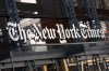 FILE - A sign for The New York Times hangs above the entrance to its building in New York, May 6, 2021. (AP Photo/Mark Lennihan, File)