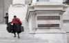 A lawyer runs up the steps of the Quebec Court of Appeal in Montreal on Tuesday, April 21, 2026. THE CANADIAN PRESS/Christinne Muschi