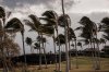 People walk along a path at Waikoloa Beach Resort as Tropical Storm Lala strengthened on the Big Island of Hawaii, Saturday, Aug. 15, 2026. (Stephen Lam/San Francisco Chronicle via AP)