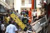 Rescue workers look for the trapped survivors under the debris of a building that collapsed in New Delhi, India, Sunday, Sept. 6, 2026. (AP Photo/ Vipin)