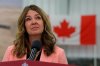 Alberta Premier Danielle Smith listens to a question during a press conference at the Canadian Forces Base in Edmonton on Wednesday, Oct. 7, 2026. THE CANADIAN PRESS/James Maclennan