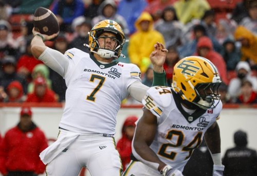 Edmonton Elks quarterback Cody Fajardo, left, throws the football during second half CFL football action against the Calgary Stampeders in Calgary, Monday, Sept. 7, 2026. THE CANADIAN PRESS/Jeff McIntosh