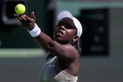Victoria Mboko, of Canada, serves against Aryna Sabalenka, of Belarus, during a quarterfinal match at the BNP Paribas Open tennis tournament, Thursday, March 12, 2026, in Indian Wells, Calif. (AP Photo/Mark J. Terrill)