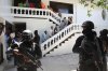 FILE - Colombians and Haitians who are accused of involvement in the 2021 assassination of Haitian President Jovenel Moise are escorted in handcuffs to their court hearing in Port-au-Prince, Haiti, May 26, 2025. (AP Photo/Odelyn Joseph, File)