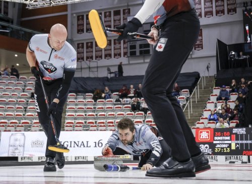 Team Dunstone skip Matt Dunstone, centre, makes a shot as teammates Ryan Harnden, left, and EJ Harnden sweep against Team Jacobs during the men's final at the PointsBet Invitational in Calgary on Oct. 5, 2025. THE CANADIAN PRESS/Jeff McIntosh