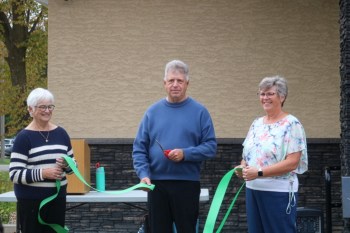 Brenda Tosh (from left), Ron Jefferies and Alexis Einarson cut the ribbon to celebrate the grand opening of the Spirit Sands Medical Clinic in Glenboro on Friday. (Rylee Gerrard/The Brandon Sun)