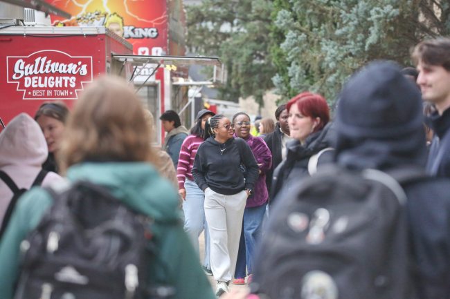 Brandon University students came out in force on the Clark Hall drop-off loop, which was festooned with six different Brandon food trucks on Tuesday during the noon hour. A large crowd of students lined the sidewalk to get a sandwich or fill that poutine craving for lunch. The food truck line was organized by the Brandon University Students' Union. (Matt Goerzen/The Brandon Sun)