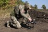 In this photo provided by Ukraine's 65th Mechanized Brigade press service, a Ukrainian soldier prepares an FPV drone to fire towards Russian positions in Zaporizhzhia region, Ukraine, Saturday, Sept. 19, 2026. (Andriy Andriyenko/Ukraine's 65th Mechanized Brigade via AP)