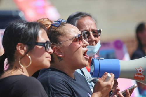 Crystal Delvenne speaks into a bullhorn at police calling for justice for her daughter, Cassity Delvenne, a 24-year-old Brandon woman who died on June 21. Family and supporters protested outside Brandon police headquarters on Wednesday afternoon, claiming police had botched the investigation into Cassity&rsquo;s death. (Matt Goerzen/The Brandon Sun)