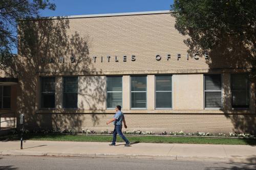 A man walks in front of the Brandon Land Titles Office on Princess Avenue on Friday. Teranet Manitoba is moving the office from its downtown location to a new site on 18th Street. (Abiola Odutola/The Brandon Sun)