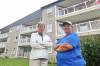 Spruce Woods Housing Co-operative board president Noreen Mitchell (left) stands with property manager Eva Cameron on Friday morning outside the housing complex on Braecrest Drive in Brandon. (Matt Goerzen/The Brandon Sun)