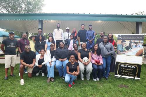 Loy Excellentia Initiative founder Aloy Anyichie (left) and his colleagues join students from Brandon University and Assiniboine College at Rideau Park on Sunday afternoon. (Abiola Odutola/The Brandon Sun)