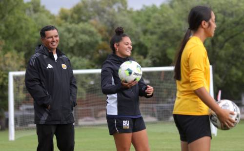 Victoria Gonzalez, centre, was named a co-captain heading into her third year with the Brandon University women's soccer team led by head coach Diego Rodriguez Sr., left. (Thomas Friesen/The Brandon Sun)