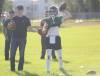 Jacob Doerksen (left), works with quarterback Sean Kelly (right) at Neelin Trojans practice on Wednesday at Neelin High school. This is Doerksen;s first full season as a head coach. (Rowan McCarthy/The Brandon Sun) Sept. 9, 2026.
