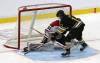 Brandon Wheat Kings forward Colin Grubb (13) tucks the puck behind Moose Jaw Warriors goaltender Kyle Jones (33) during Western Hockey League action at Assiniboine Credit Union Place on Friday. (Photos by Perry Bergson/The Brandon Sun)
