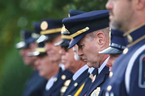 A member of the Office of the Fire Commissioner in Manitoba bows his head during a memorial service at the International Peace Garden on Friday, marking the 25th anniversary of the Sept. 11, 2001 terrorist attack on the United States. (Matt Goerzen/The Brandon Sun)