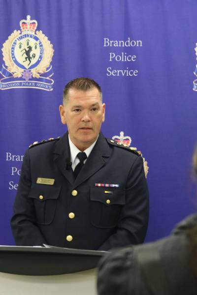 Brandon Police Service Chief Tyler Bates speaks with reporters during a media event at the A.R. McDiarmid Civic Complex on Friday. (Rylee Gerrard/The Brandon Sun)