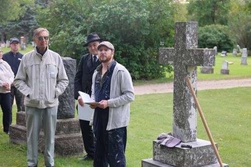 Keith Waterfield portrays Peter Middleton during Gossip in the Graveyard at the Brandon Municipal Cemetery on Saturday evening. Middleton was a horticulturist, parks board member, alderman and advocate for the beautification of Brandon. (Abiola Odutola/The Brandon Sun)