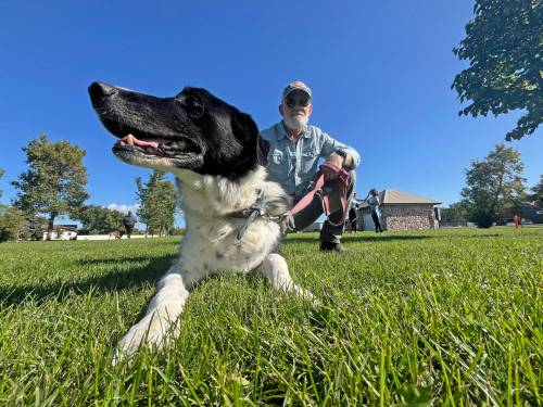 Brian Will from Kemnay spents time with Bogey, a 15-year-old border collie during the annual Wag-A-Tail Walk-A-Thon at Kin Park, which raises money for the Brandon Humane Society operations. (Matt Goerzen/The Brandon Sun)