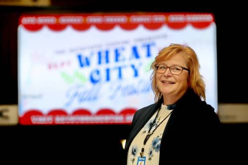 Keystone Centre CEO Connie Lawrence stands in front of a video sign advertising the Wheat City Fall Festival this weekend. (Matt Goerzen/The Brandon Sun)